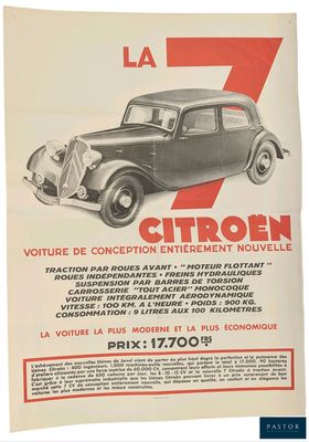 a poster advertising a car that is parked in front of a building