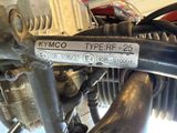 a close up of a motorcycle engine with a sticker on it
