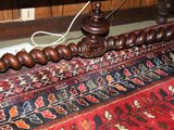 a picture of a bed with a wooden headboard and foot board