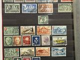 a picture of a display of stamps in a glass case