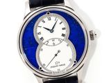 an image of a close up of a wrist watch with a blue and white dial