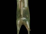 an image of a bronze statue of a person on a black background