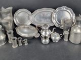 a lot of silver items that are sitting on a table