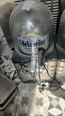 two bottles of beer sitting on top of a counter