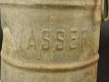 a stone bucket with a handle on a black background