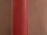a red book that is sitting on top of a table