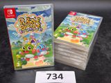 beaucoup de jeux Nintendo posés sur la table, avec une étiquette de prix