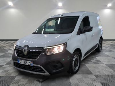 the white van is parked on a checkered floor in a room