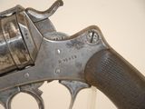 an old gun that is on display in a museum