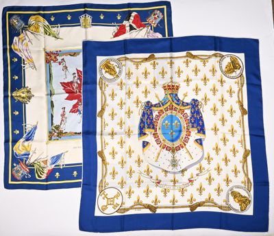two blue and white handkerchiefs with a picture of a man on a horse