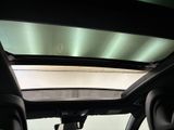 a view of the sunroof from inside of a car