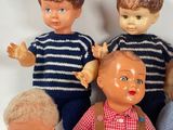 a group of dolls that are sitting together on a table