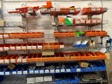 many bins of assorted items on the shelves