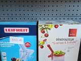 two boxes of food sitting on a shelf in a store