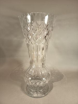 a glass vase that is sitting on a table
