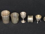 many different types of silverware laid out on the table