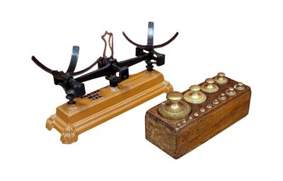 a wooden box and a metal device on a white background