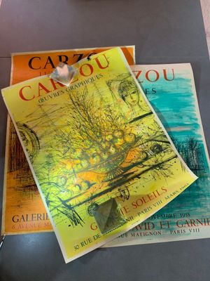 two books sitting on a table next to a pair of scissors
