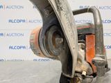 a close up of a chainsaw on a table in front of a wall