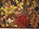 many different types of flowers displayed on the wall