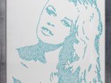 framed art print of a woman ' s face in blue glitter