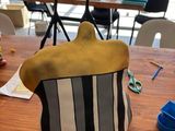 a stuffed animal sitting on top of a wooden table