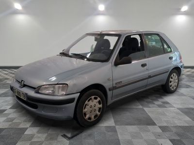 a silver car that is sitting on a checkered floor