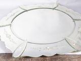 a glass platter with a decorative design on it