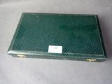 a green box with a label on it sitting on a table