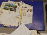 a blue folder with a bunch of letters on it
