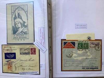 an open book with a lot of stamps on it sitting on a table