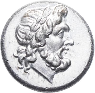 a close up of a silver coin with a man ' s face on it
