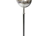 an image of a metal ball on a stand with a white background