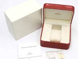 a red box with a white watch inside of it