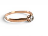 a close up of a ring with a stone on it