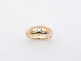 a yellow gold ring with a diamond set in the center