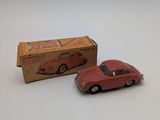 a toy car that is sitting next to a box