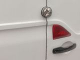 a white van that is parked on the side of the street