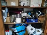 a cabinet with many items on it in the room
