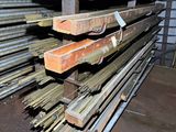 a large stack of steel bars stacked on top of each other