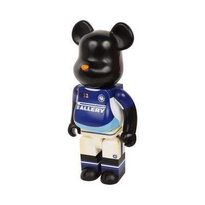 the bear is wearing a blue jersey and white shorts