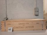 a wooden box with a label on it sitting on a table