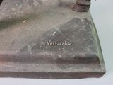 a statue of a man riding a horse on a stone base