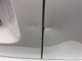 a close up of a car door with a hole in it