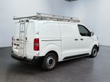 a picture of a white van with a ladder on the back