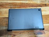 a laptop that is sitting on a wooden table