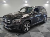 the mercedes gls is parked on a checkered tile floor