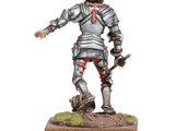 a small figurine of a man in armor with a sword