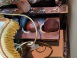 a box full of assorted items including a lamp