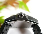 a close up of a watch on a white surface